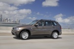 2013 BMW X5 xDrive35i in Sparkling Bronze Metallic - Driving Left Side View